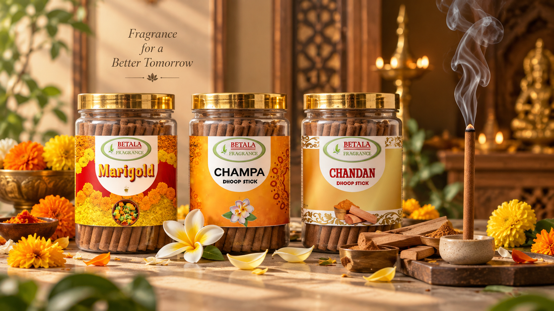 Betala Fragrance charcoal-free dhoop sticks in Marigold, Champa, and Chandan fragrances arranged with flowers and a lit incense stick in a warm devotional setting.